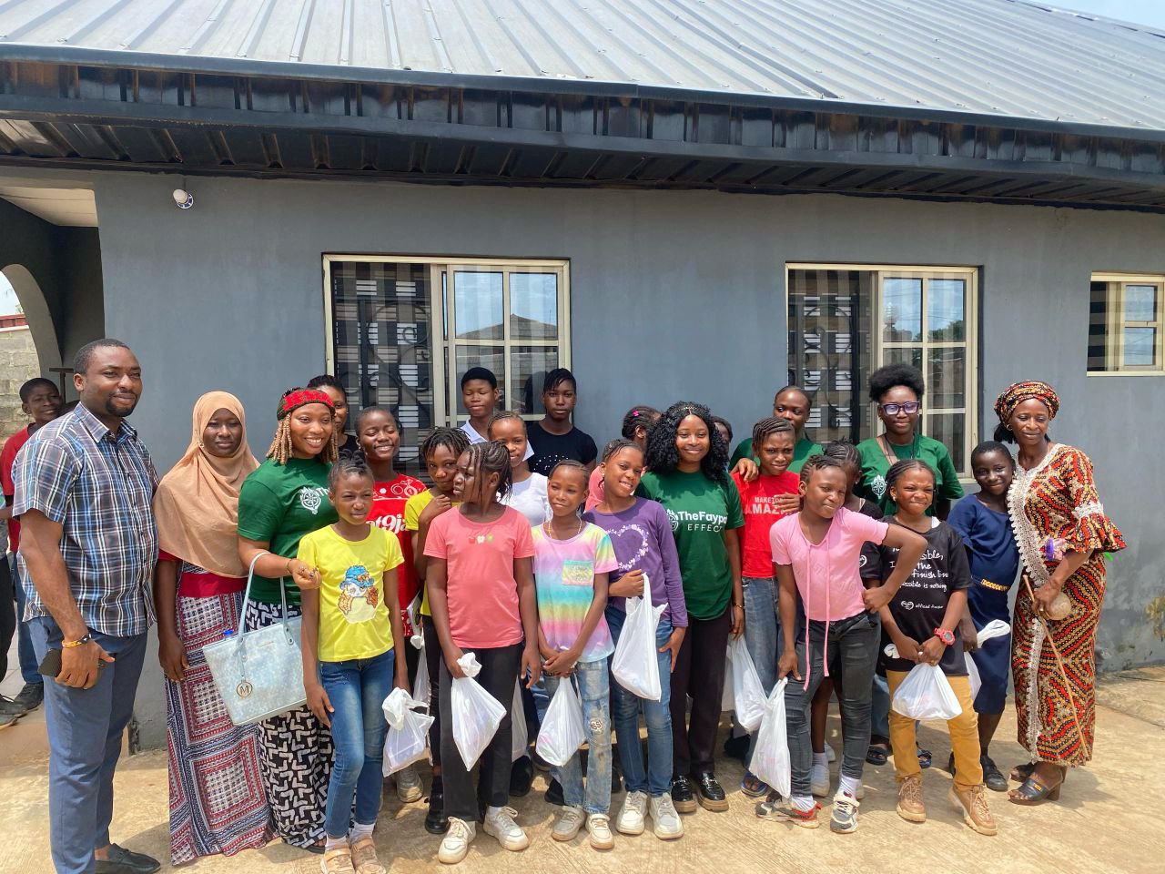 Faypat Effect volunteers gathered with children during an orphanage visitation in Nigeria